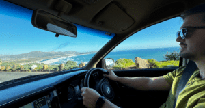 Man driving along the coast in South Africa